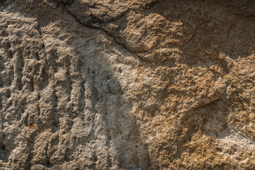 Detail shot of orange sandstone brick wall texture.