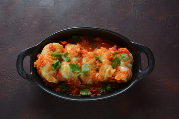 Cabbage rolls stuffed with ground beef and rice in tomato sauce