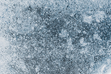 Fototapeta na wymiar Ice texture background. Textured frosty surface of ice blocks against dark blue.