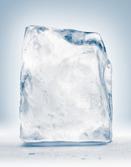 Frozen block of textured clear blue ice. Clipping path included.