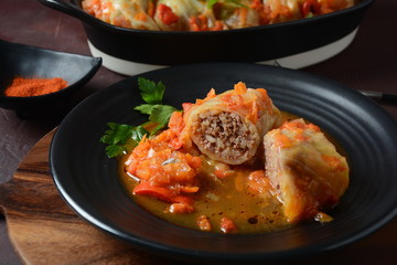 Cabbage rolls stuffed with ground beef and rice in tomato sauce