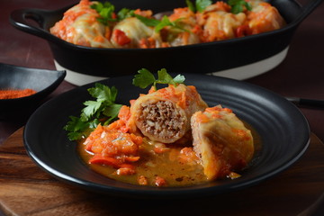 Cabbage rolls stuffed with ground beef and rice in tomato sauce