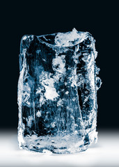 Crystal clear natural ice block on black background. Clipping path included.