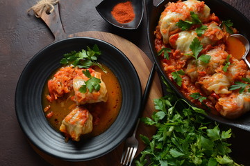 Cabbage rolls stuffed with ground beef and rice in tomato sauce