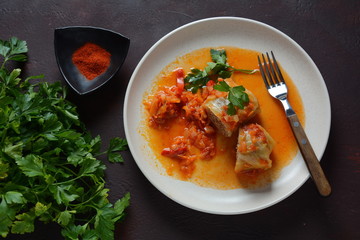 Cabbage rolls stuffed with ground beef and rice in tomato sauce
