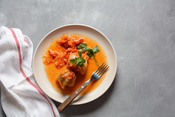 Cabbage rolls stuffed with ground beef and rice in tomato sauce
