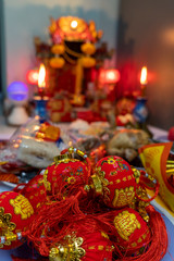 A small red lantern is placed in front of the shrine for Chinese New Year.