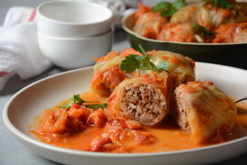 Cabbage rolls stuffed with ground beef and rice in tomato sauce