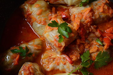 Cabbage rolls stuffed with ground beef and rice in tomato sauce