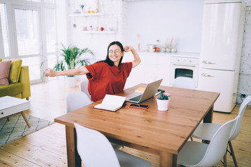 Female taking break and stretching out with hands