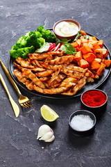 Roasted chicken strips and glazed sweet potato