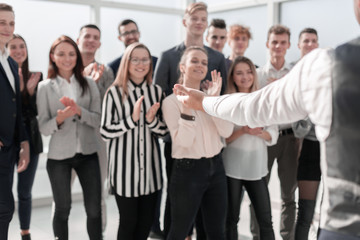 project Manager and a group of young professionals standing in the spacious lobby