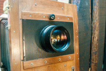 Old photographic camera with lens of bellows. Front view