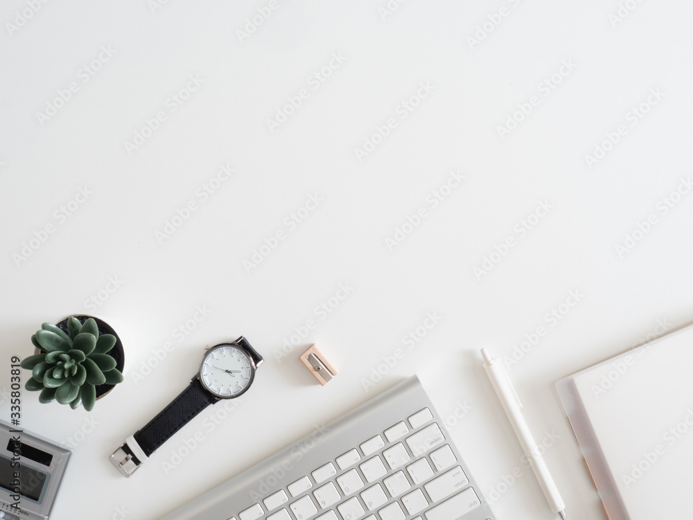 Poster top view of work from home concept with keyboard, calculator and notebook on white background, graph
