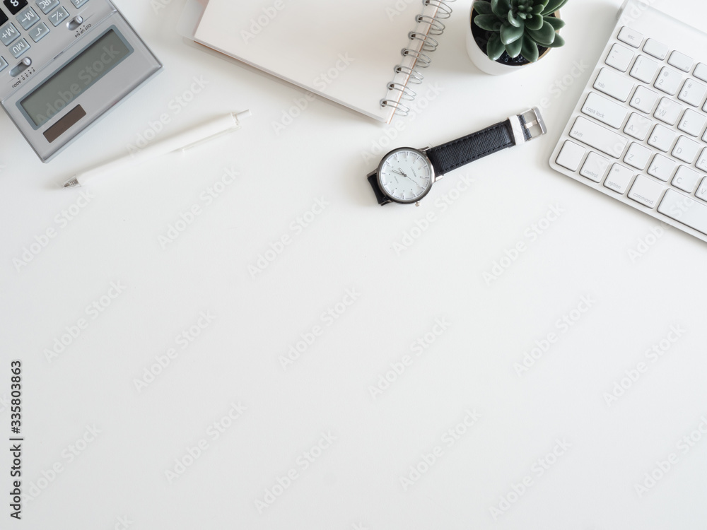 Poster top view of work from home concept with keyboard, calculator and notebook on white background, graph