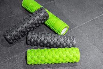 four foam rollers for massage in gym