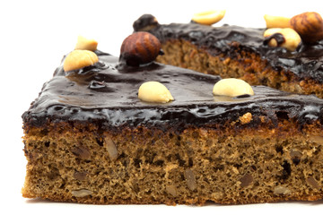 Homemade cake with nuts on a white background