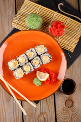 Baked sushi, rolls sprinkled with sesame seeds