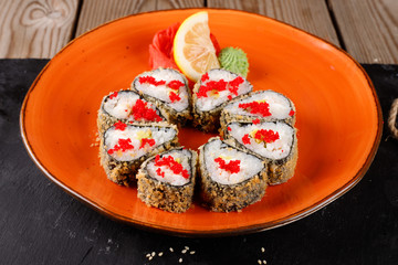 Baked sushi, rolls sprinkled with sesame seeds