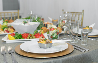 Dining table full of food served with light dishes