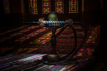 Hookah hot coals on shisha bowl with black background. Stylish oriental shisha. Shisha Concept