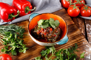 Dolma stuffed with grape leaves with rice and meat. The view from the top.