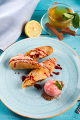 Apple strudel with vanilla ice cream and mint