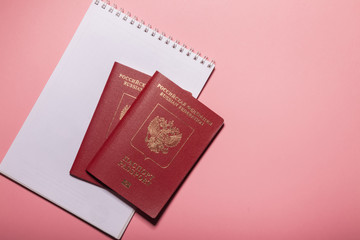 Two foreign passports Russia on a pink background