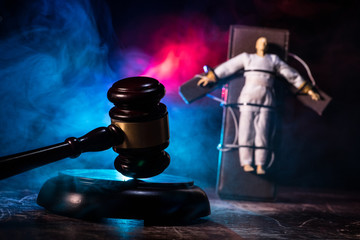 Prisoner handcuffed to death by lethal injection, vial with sodium thiopental and syringe on top of...