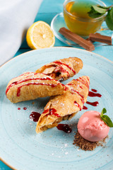 Apple strudel with vanilla ice cream and mint