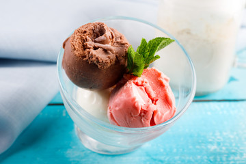 Raspberry ice cream in white bowl overhead shot