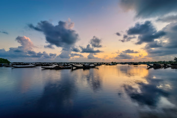 Boats in Tam Giang lagoon in sunrise in Hue, Vietnam