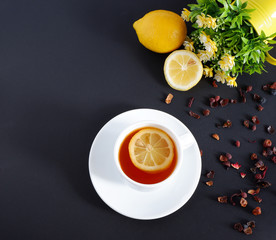 tea with lemon on a black background. Set: ceramic mug and saucer on a white background. Beautiful advertising background