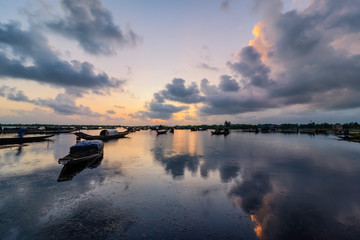 Boats in Tam Giang lagoon in sunrise in Hue, Vietnam