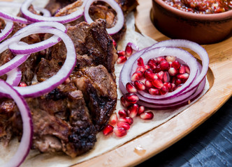 Georgian cuisine food. Grilled meat with khinkali. Georgian restaurant.