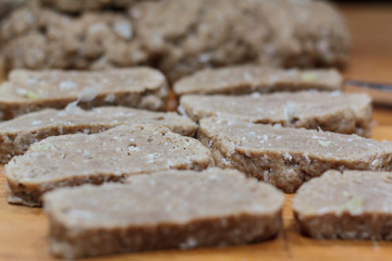 Homemade seitan slices on wooden board