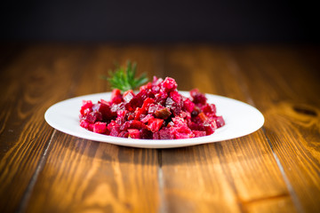 salad boiled vegetables salad on a wooden table
