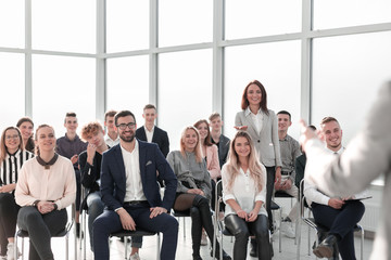 image of a speaker giving a lecture at a business seminar