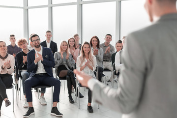 image of a speaker giving a lecture at a business seminar