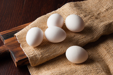 Chicken eggs on burlap, rustic still life