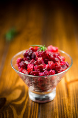 salad boiled vegetables salad on a wooden table