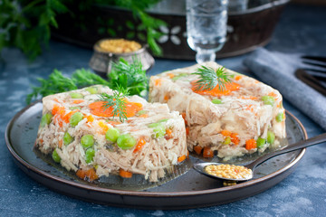 Homemade jelly with chicken, pork peas with slices of carrots, horizontal