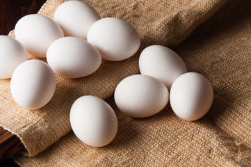 Chicken eggs on burlap, rustic still life