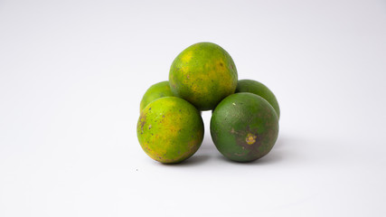 lemon lime fresh juice (Citrus Sinensis) or Jeruk nipis, isolated on white background.
