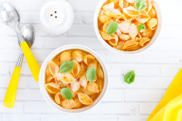 Pasta casserole with egg in white ceramic tins, selective focus