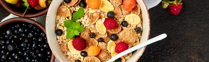 Banner of Healthy vegetarian breakfast. Oatmeal, granola with raspberries