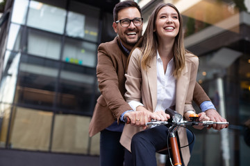 Portrait of happy smiling business people talking in the city