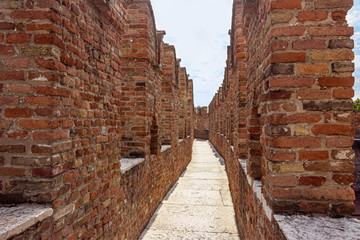Fototapeta na wymiar Fragment of the fortress wall Castelvecchio castle in Verona, Italy