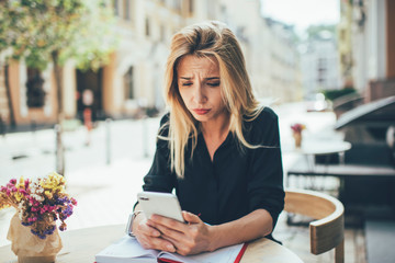 Unhappy woman sad with account balance after banking smartphone operation, disappointed female...