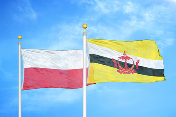 Poland and Brunei two flags on flagpoles and blue cloudy sky